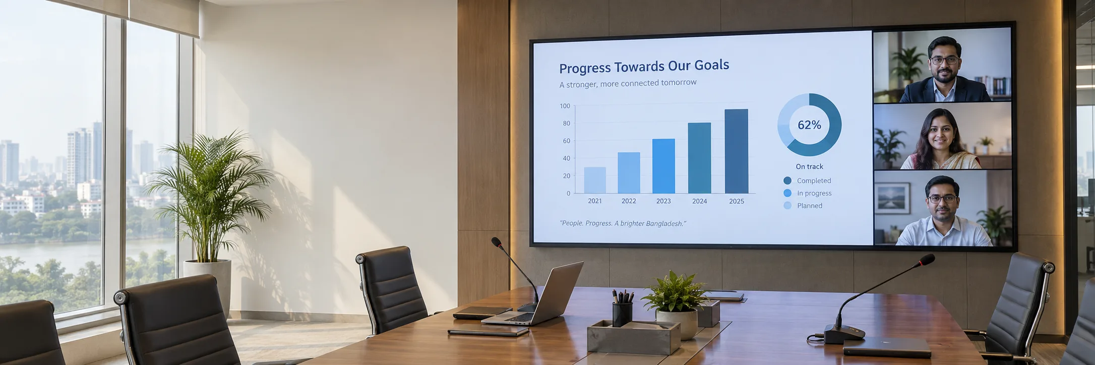 Conference room LED wall showing a presentation and video meeting