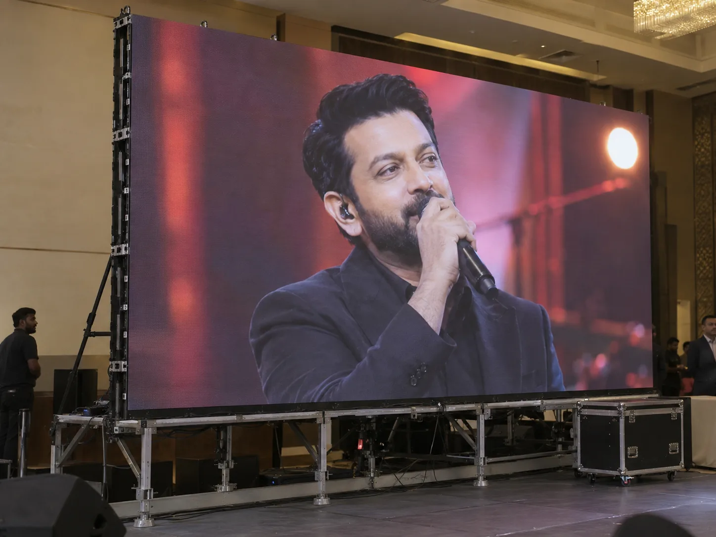 Modular rental LED wall displaying a singer at an indoor event